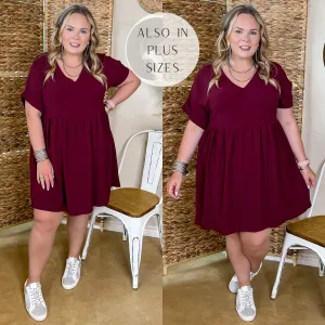 Touring the City V Neck Babydoll Dress in Maroon